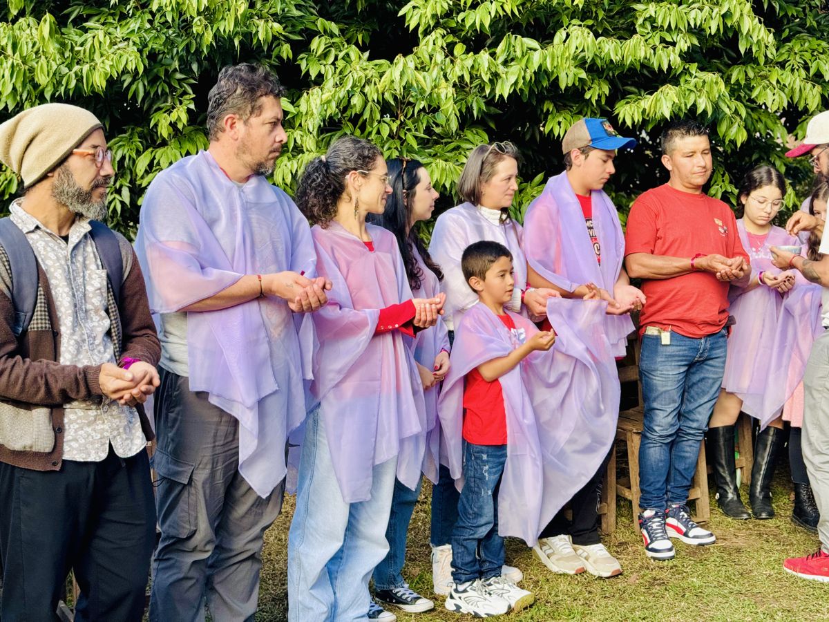 Families in violet veils holding hands